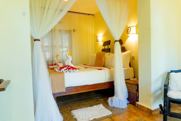 Double room decorated with heart-shaped rose petals at Weruweru River Lodge, Moshi Tanzania