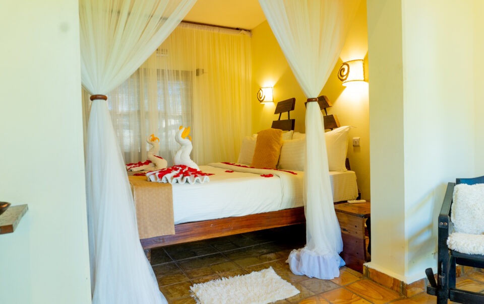 Double room decorated with heart-shaped rose petals at Weruweru River Lodge, Moshi Tanzania