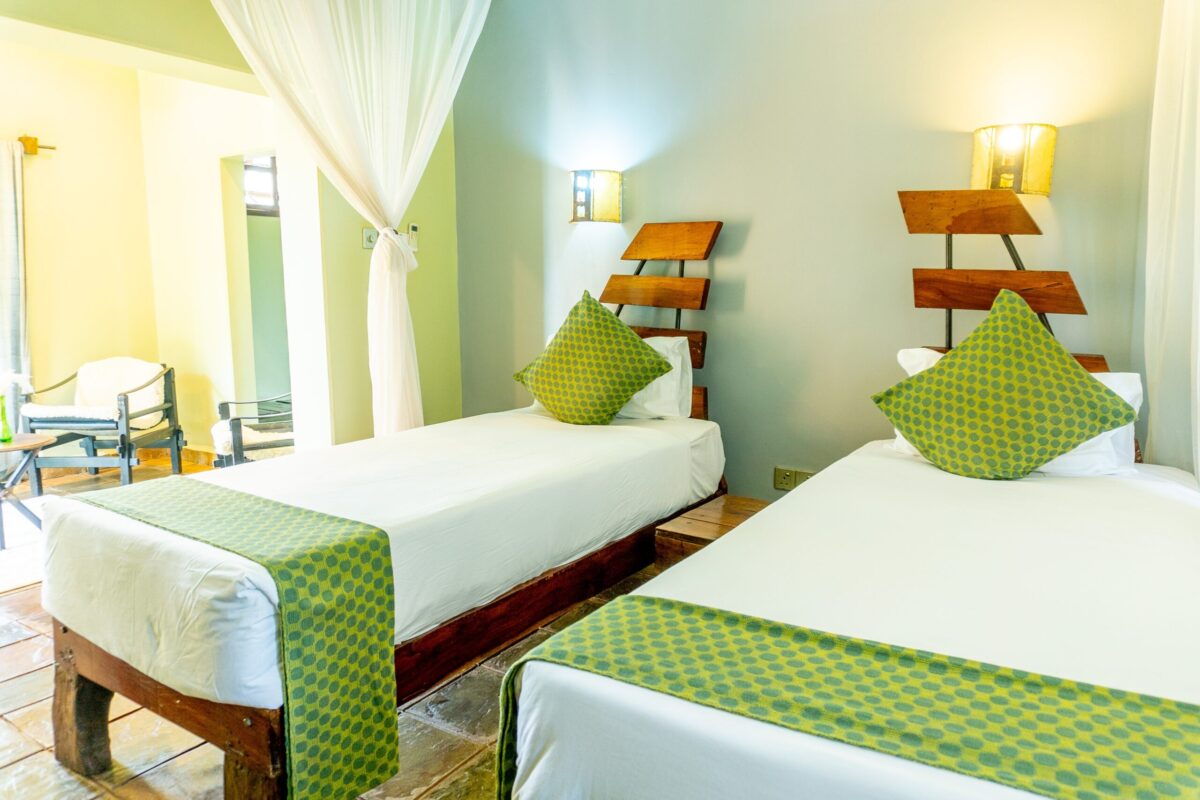 Twin room with garden-facing windows at Weruweru River Lodge, Moshi Tanzania